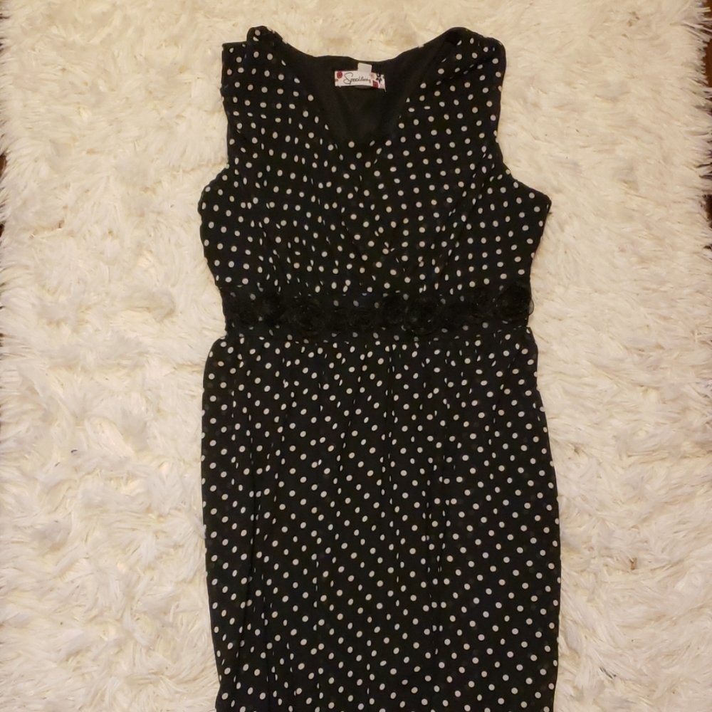 Black and white sleeveless polka dot dress